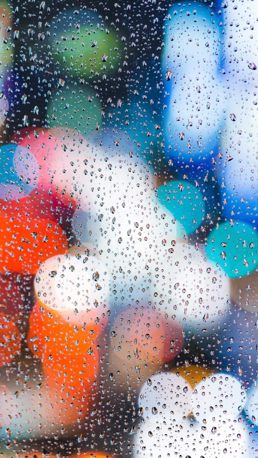 玻璃上的雨滴唯美光晕手机壁纸